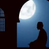 image of a person praying in the moonlight